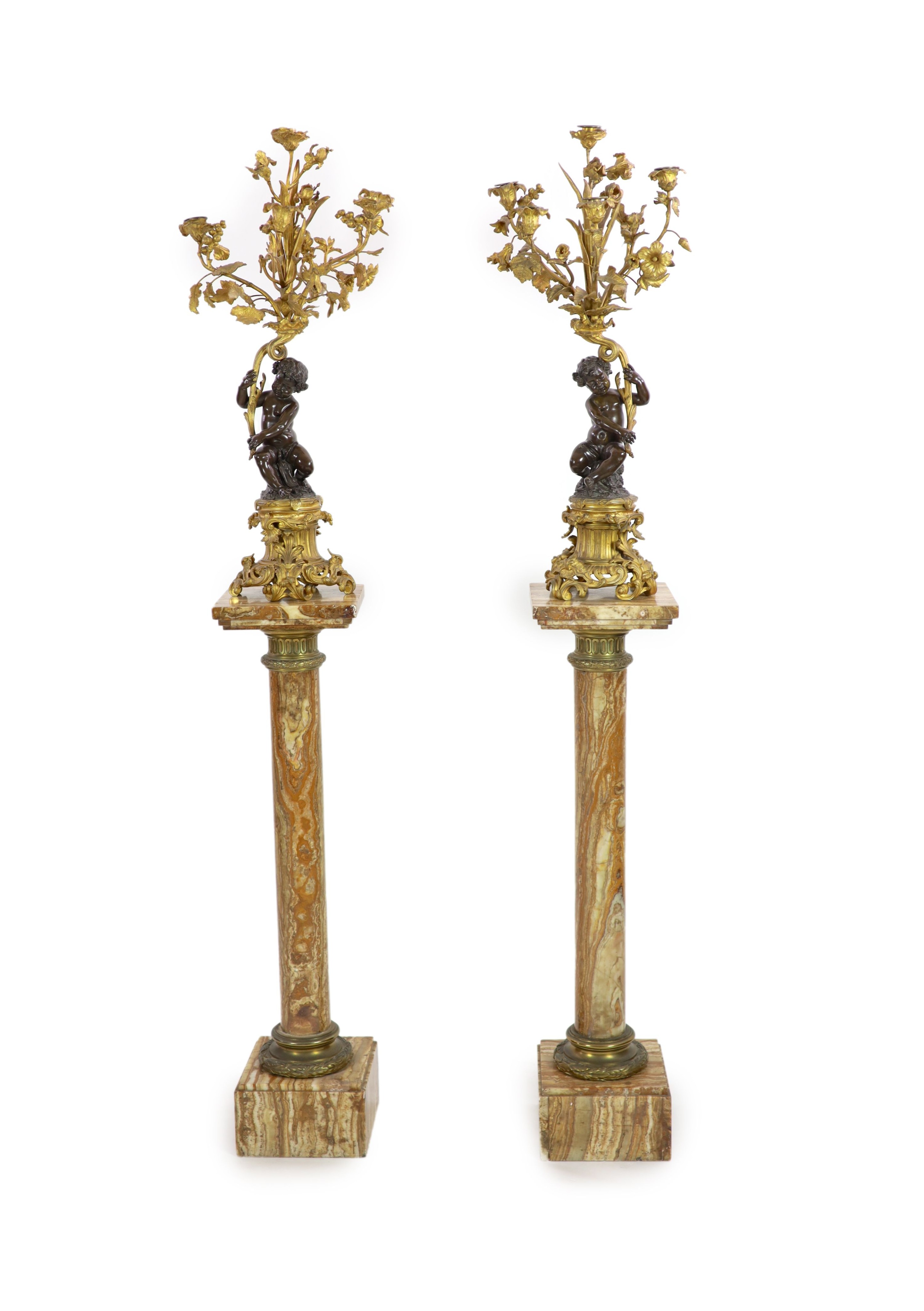 A pair of 19th century French bronze and ormolu six light candelabra, W.27cm H.109cm